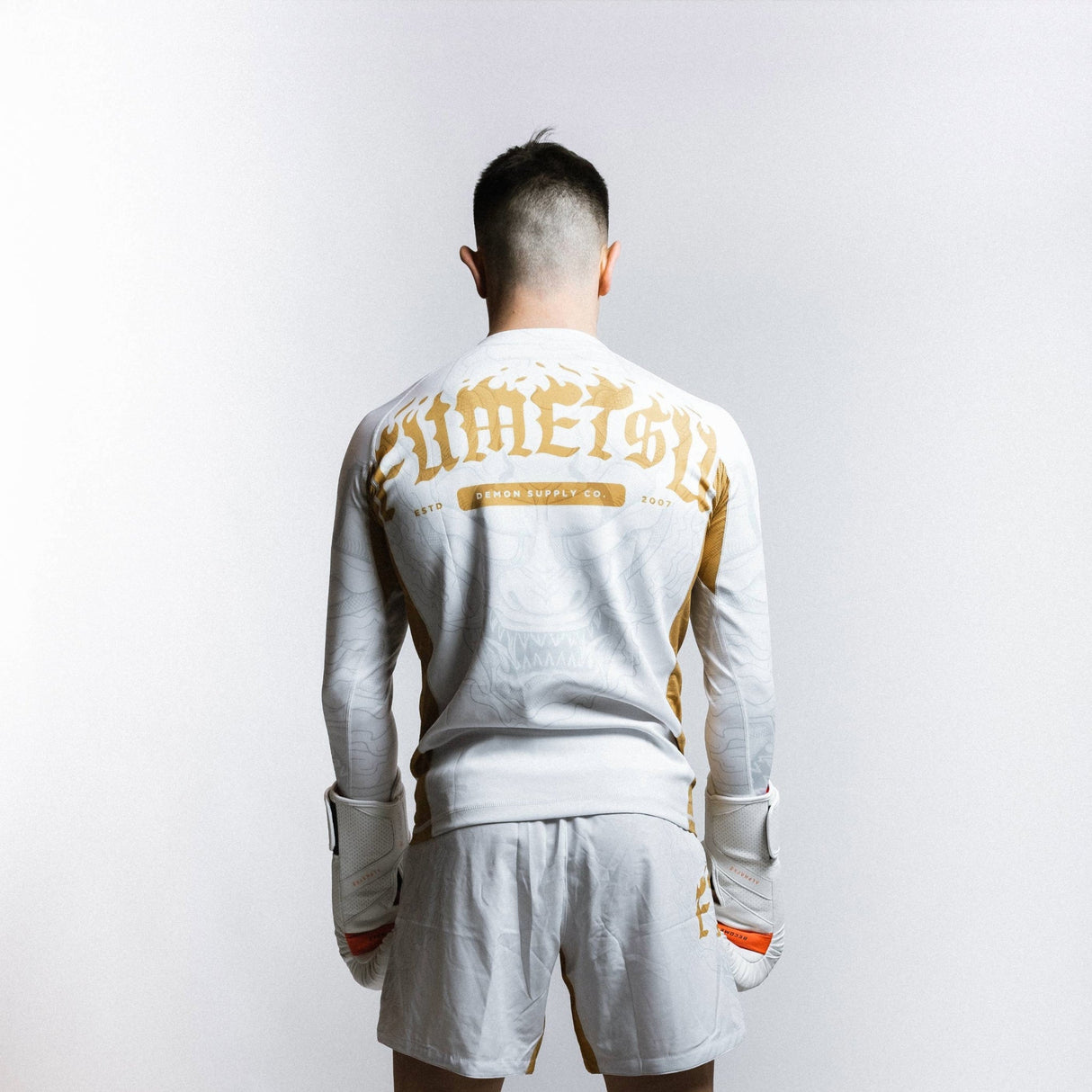 Fumetsu Oni Long Sleeve Rash Guard White/Gold/Grey