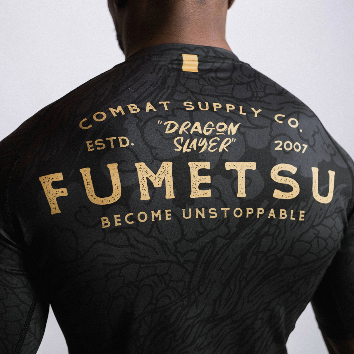 Fumetsu Dragon Slayer Short Sleeve Rash Guard Black/Gold