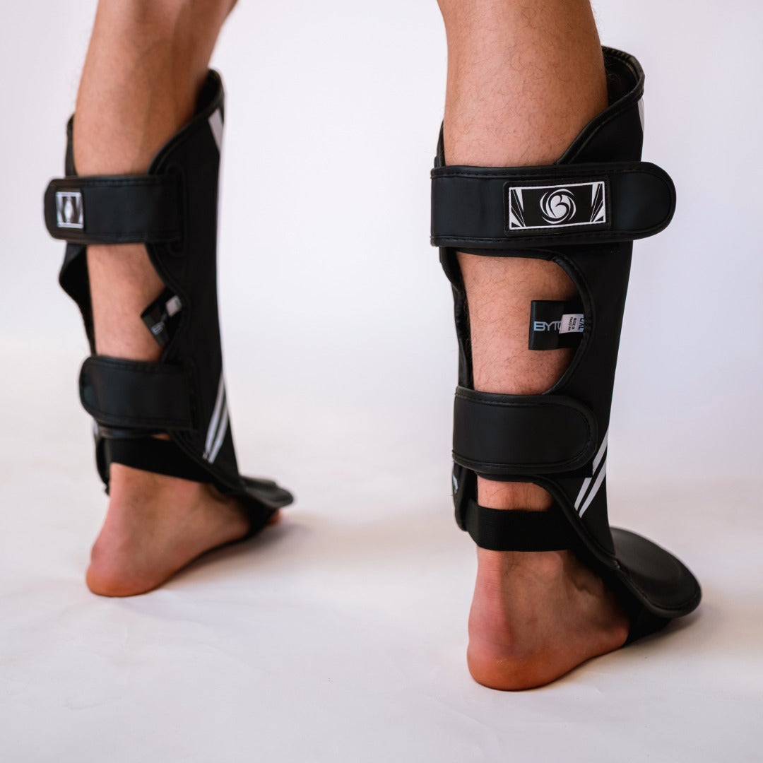 Black/White Bytomic Axis V2 Shin Instep Guards