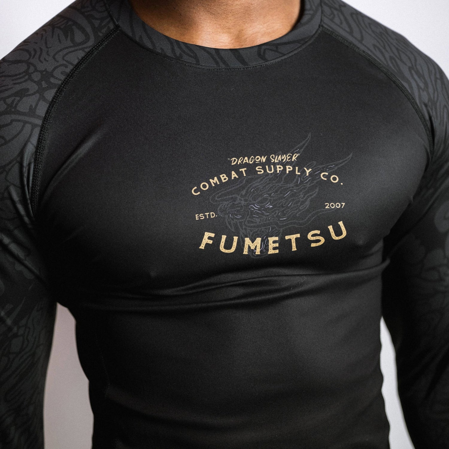 Fumetsu Dragon Slayer Long Sleeve Rash Guard Black/Gold